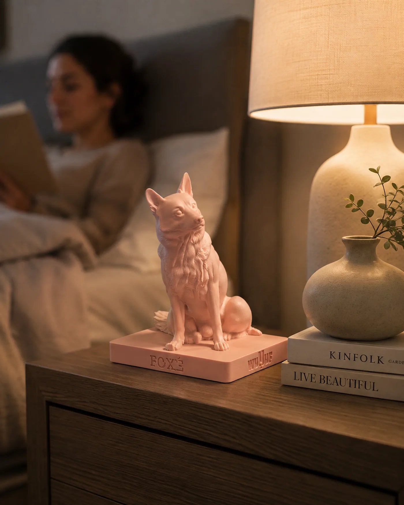 A Blush corgi WUUUF on a bedside table